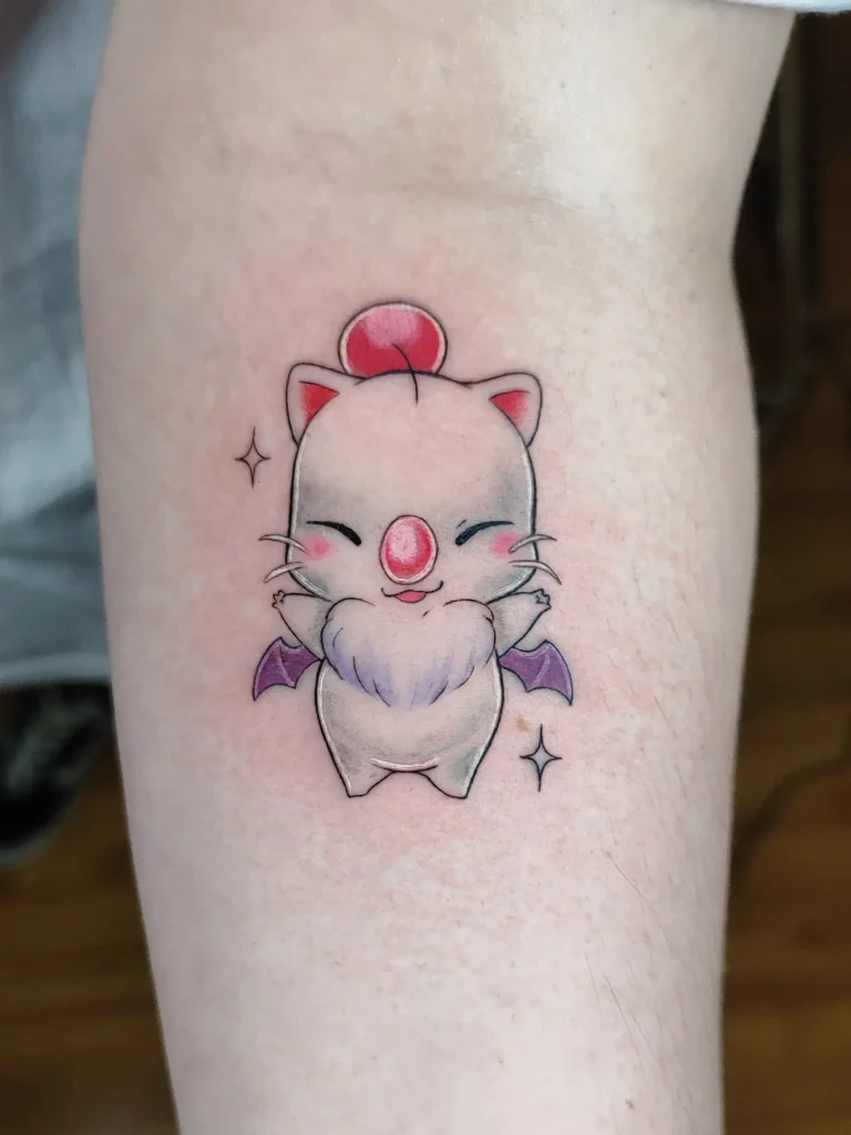 Tatuaje de un Moguri a color en antebrazo